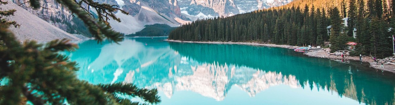 Turquoise glacial water at Grassi Lakes near Canmore, Alberta surrounded by Rocky Mountain forest