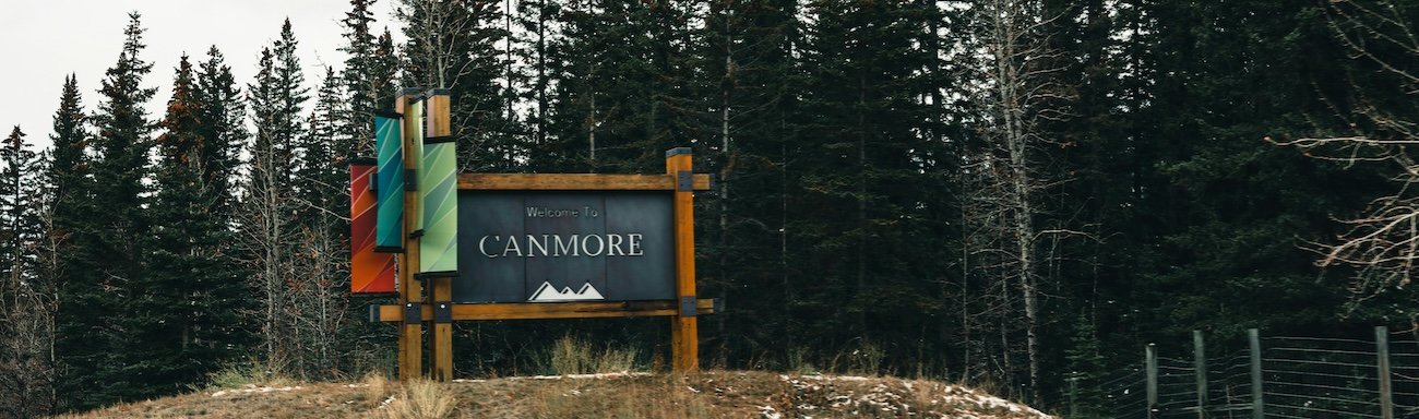 Hiker on the Ha Ling Peak trail overlooking Canmore and the Bow Valley, Alberta