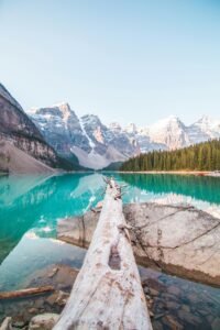 Hikers on the Plain of Six Glaciers trail with Victoria Glacier visible in the background, Banff