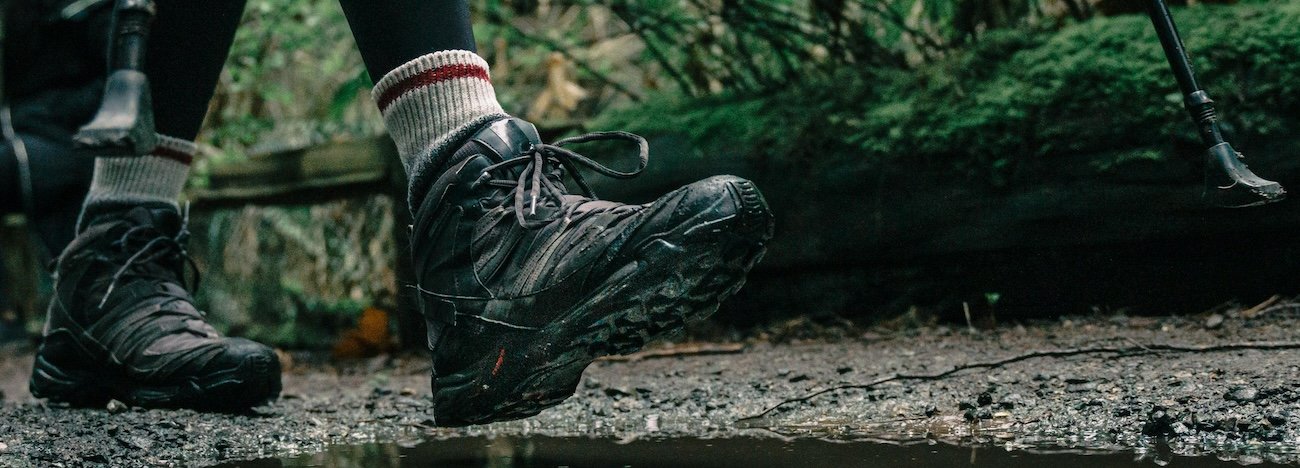 Close-up of waterproof hiking boots on a rocky trail in Jasper National Park