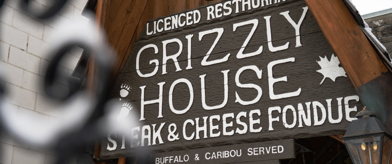 Rustic dining room interior at The Grizzly House restaurant in Banff