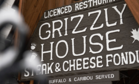 Rustic dining room interior at The Grizzly House restaurant in Banff