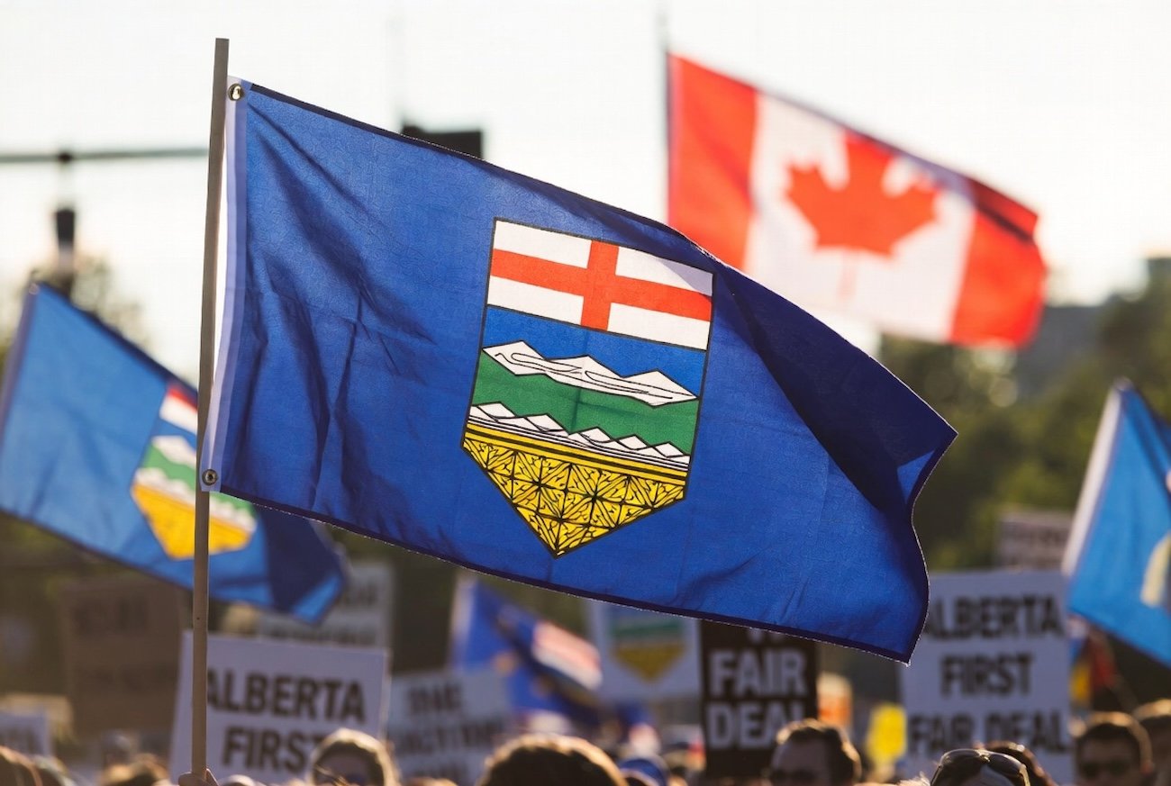 Alberta flag at protest illustrating separatism movement 2026