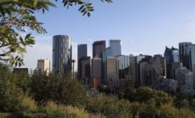 Calgary skyline with housing and cost of living charts 2026